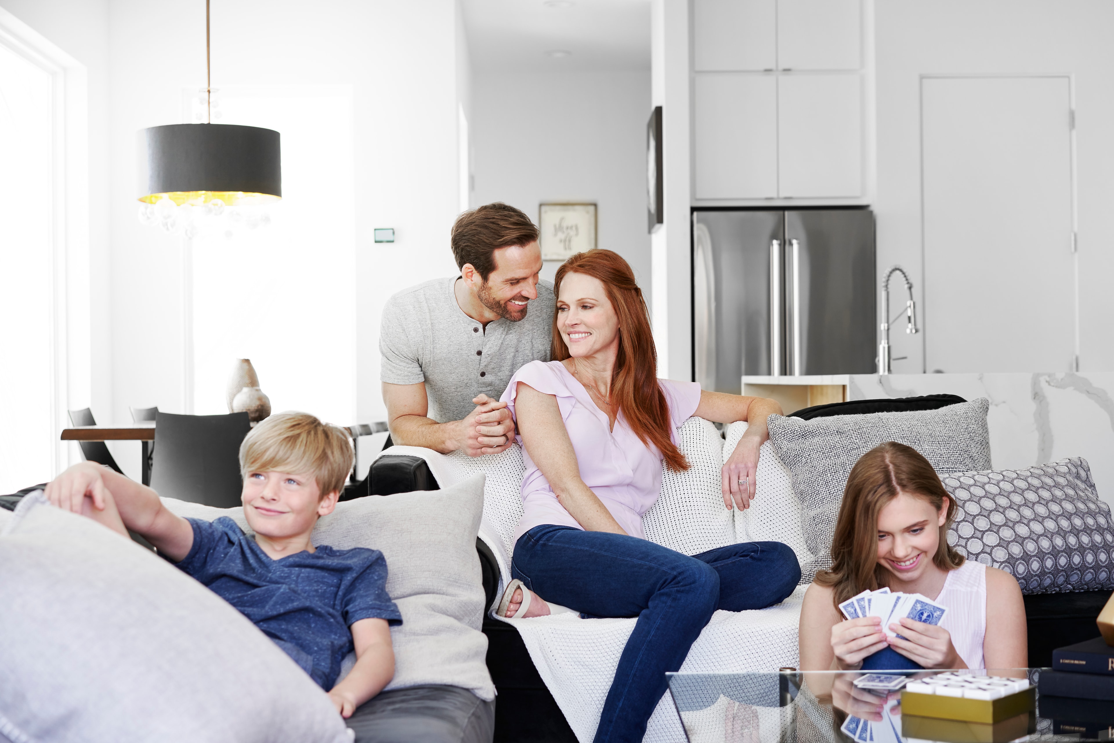 Family relaxing comfortably in a cool modern living room