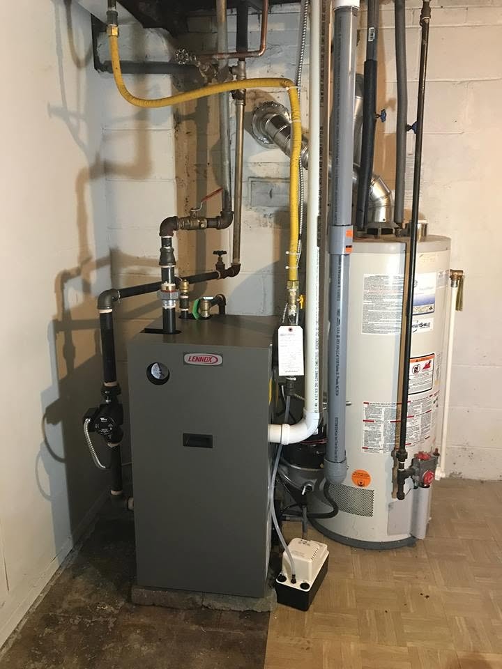 Lennox furnace and water heater installation in a residential utility room