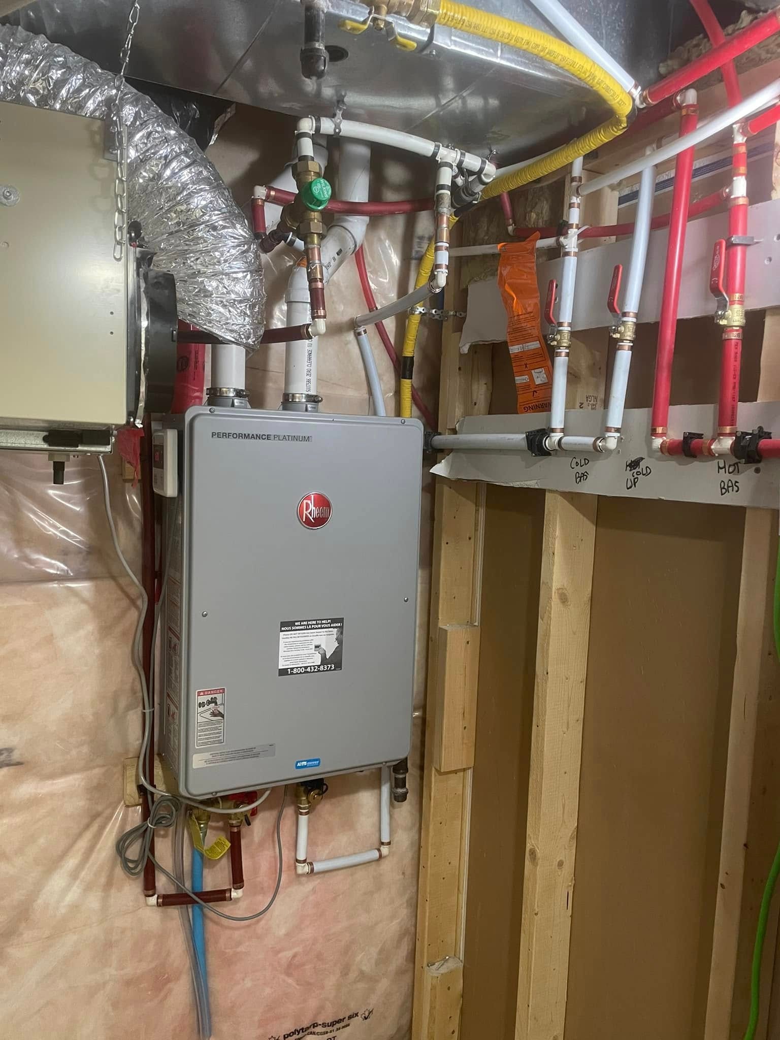 Rheem Performance Platinum tankless water heater installation with connected plumbing
